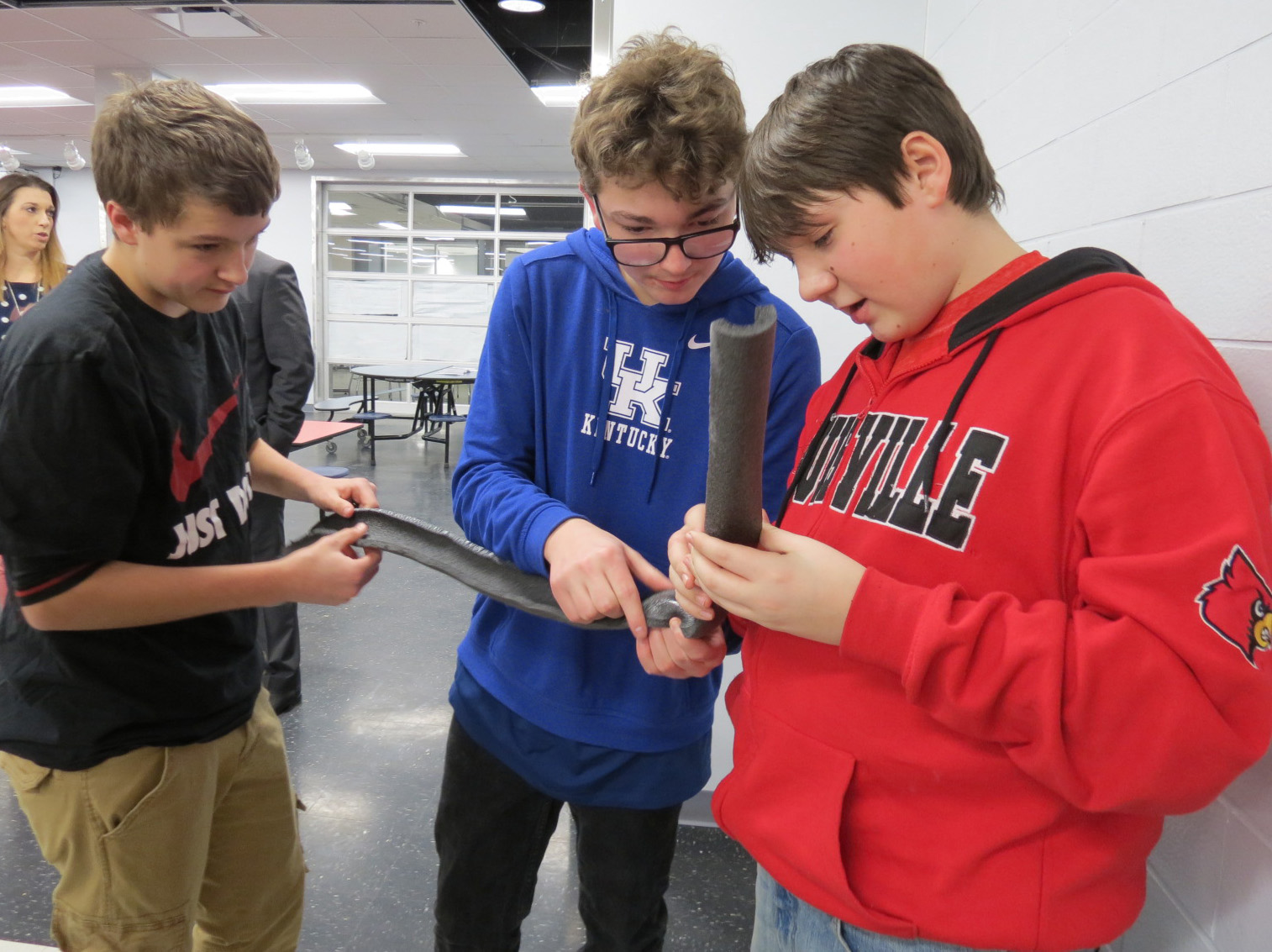 North Bullitt High School students, from left, Dakota Centers, Alex Rightsell and Brandon Bowles work on their roller coaster track. Photo submitted