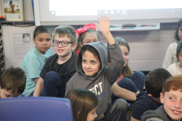 Second grader answering the principle's question. As you can see, the students were pretty intrigued by her. Photo by Megan Gross