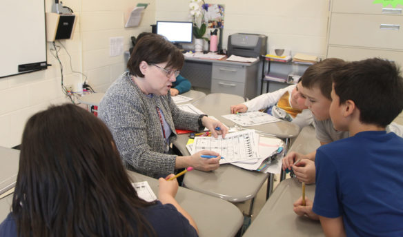 Patti Farley, a Title I interventionist at Spottsville Elementary School, works with a group of students during a Tier II intervention. Photo by Megan Gross, March 20, 2019