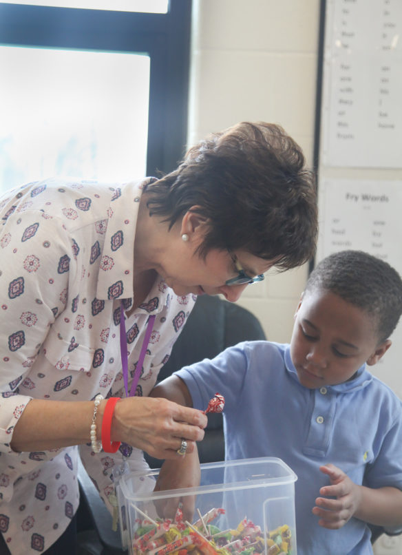 Diane Parker, a Title I interventionist at Spottsville Elementary School, lets student Kalaidren Baker select a piece of candy following his intervention session. Photo by Megan Gross, March 20, 2019