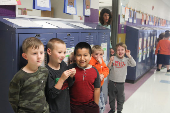 Students line up in a hallway at Gamaliel Elementary School, where one teacher said students at the school don’t have the option of staying at the Novice level.