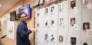David Mato, instructional media teacher at Maxwell Elementary School (Fayette County), shows off the interactive bulletin board created by the school's STLP students.