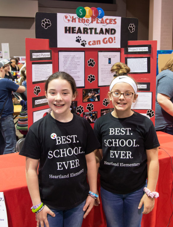 Heartland Elementary (Hardin County) students Harper Taylor and Vivianna Avey stand in front of their project at the STLP State Championship.