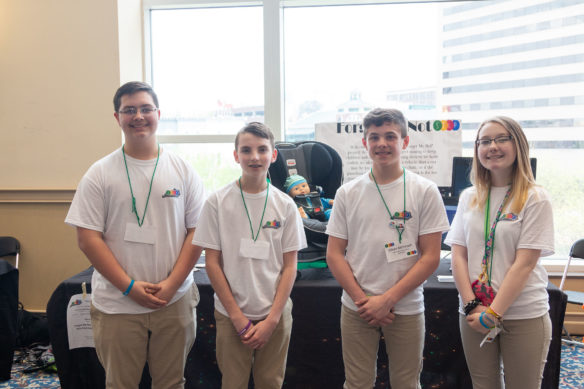 Tanner Skeens, from left, Bradley Jervis, Ethan McIntosh and Lexi Blair from Allen Elementary (Floyd County) pose in front of their project at the STLP State Championship.