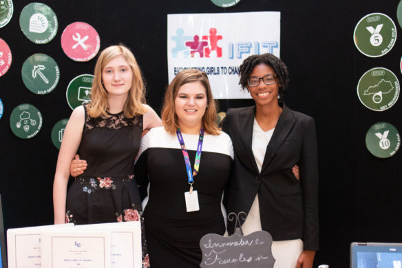 Katie Massie, from left, Sarah Cooper and Jada Hunter-Hays of LaRue County High School pose at their booth during the STLP State Championship.