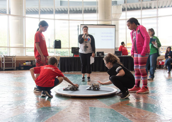 Two teams compete in the SumoBots competition at the STLP State Championship.