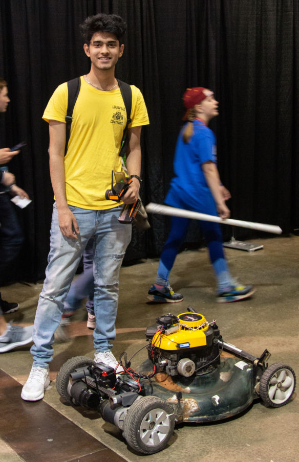 Rustan Rana from Central High School (Jefferson County) poses with his remote control lawn mower before heading to a competition at the STLP State Championship