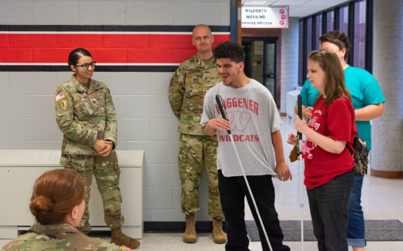 Cory Wallace, an 8th-grader at KSB, greets the first responders as they arrive for the accessible Easter egg hunt. Photo by Jacob Perkins, April 19, 2019