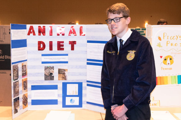 Gunnar Jones from Spencer County from Spencer County High School stands in front of his Agriscience project. Jones says that FFA has been a positive experience for him.