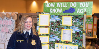 Alexis Adams from Mason County High School stands in front of her project for the Agriscience fair at the 2019 FFA State Convention Expo.
