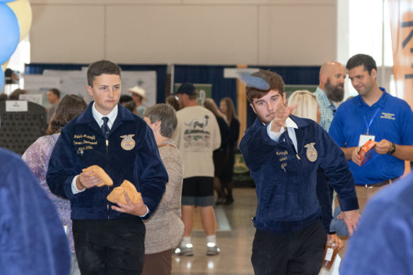 Marion County High School students Jacoby Mattingly, from left, and Randall Mattingly play a round of cornhole at the 90th Kentucky State FFA Convention.