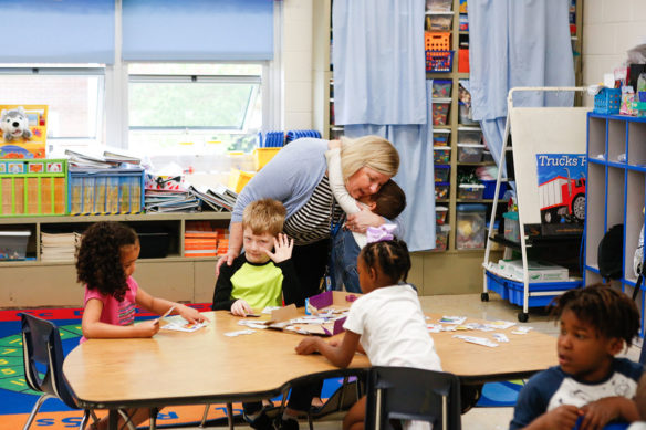 Sondra Gibbs, the principal at Fulton County Elementary School, gets a hug from a student. Photo by Mike Marsee, April 23, 2019