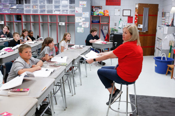 Trina Fuller shows a book to her 4th-grade students at Hickman County Elementary School during a reading lesson. Photo by Mike Marsee, April 23, 2019