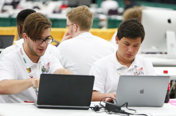 Gabriel Martin, left, points out something on his laptop screen to teammate Cross Berry during the web design competition at the SkillsUSA Championships. The two are students at Breckinridge County Area Technology Center, one of 24 Kentucky secondary schools and area technology centers represented at the event. Photo by Mike Marsee, June 26, 2019