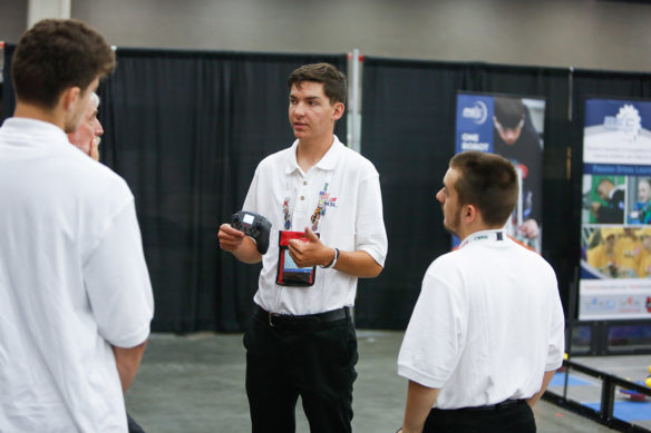 Tyler Daley, center, and John Willis, right, students at Gateway Academy to Innovation and Technology (Christian County), talk to other students and officials during the mobile robotic technology competition at the SkillsUSA Championships. Photo by Mike Marsee, June 26, 2019