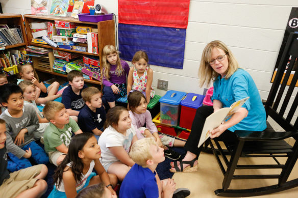 Karen Vance reads with students in her 1st-grade classroom at Wyan-Pine Grove Elementary School.