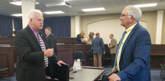 David Horseman, right, an associate commissioner at the Kentucky Department of Education, talks with Rep. Bobby McCool (R-Van Lear), co-chairman of the Kentucky Career and Technical Education Task Force, following a meeting of the task force. Photo by Mike Marsee, Oct. 2., 2019