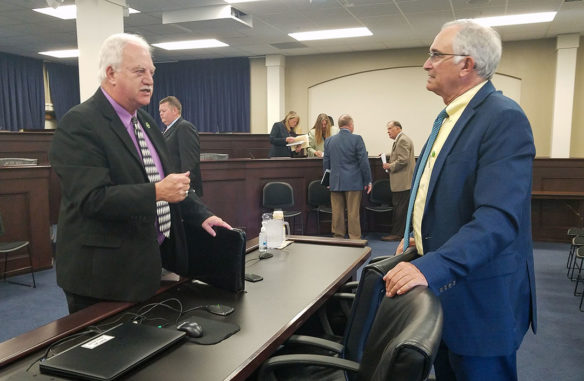 David Horseman, right, an associate commissioner at the Kentucky Department of Education, talks with Rep. Bobby McCool (R-Van Lear), co-chairman of the Kentucky Career and Technical Education Task Force, following a meeting of the task force. Photo by Mike Marsee, Oct. 2., 2019