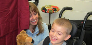 Melanie Callahan uses a puppet theater production of the book "Bear Feels Sick" by Karma Wilson during a creative dramatics class at Laurel County public schools.