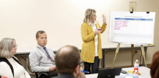 Catrina McDermott, the principal at Pineville Independent School, makes notes as a group discusses expected and unexpected impacts of Kentucky’s school accountability system during a meeting of educators and education stakeholders assembled by the Kentucky Department of Education. Photo by Mike Marsee, Oct. 22, 2019