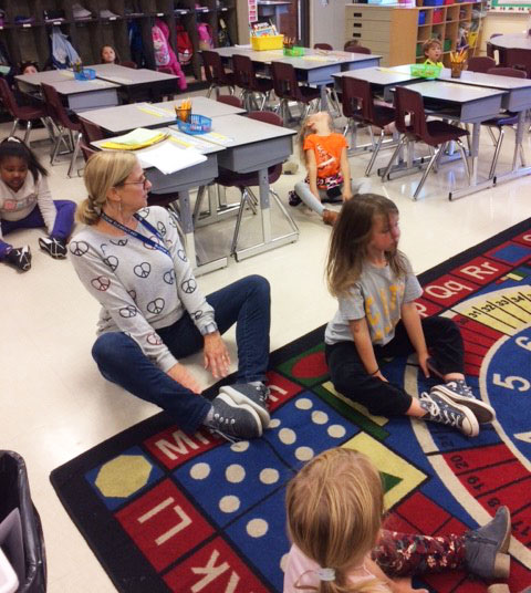 Cindy Plappert leads a mindfulness lesson with students from Bloom Elementary (Jefferson County).