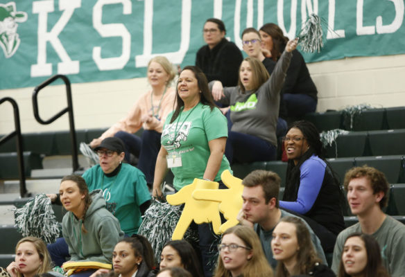 Jennifer Sanders, a student development associate at Kentucky School for the Deaf, cheers along with other KSD staff members during the Colonels’ game against South Carolina School for the Deaf and Blind in the Mason-Dixon Tournament at KSD. Photo by Mike Marsee, Jan. 23, 2020