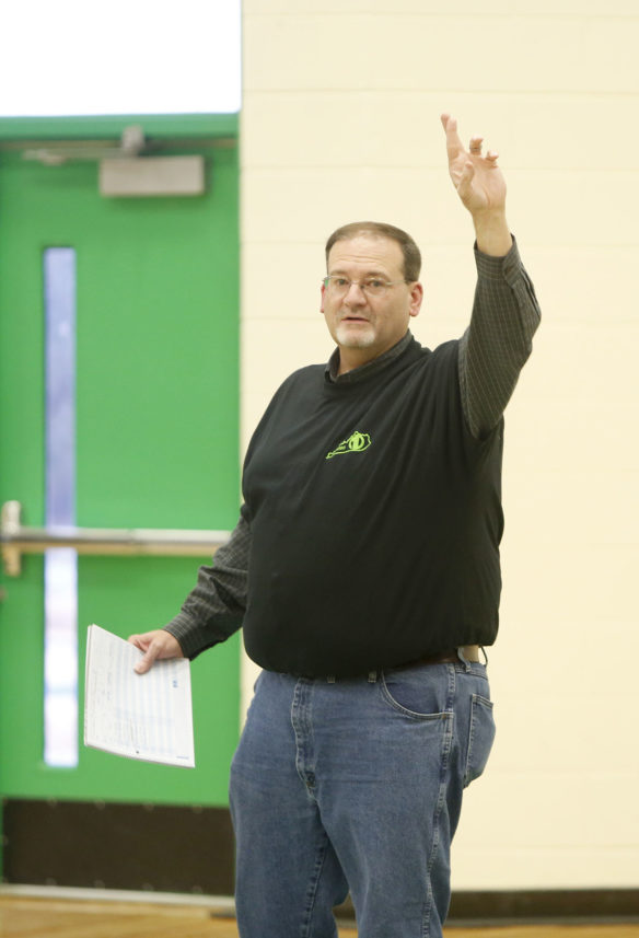 Byron Wilson, an elementary school teacher at Kentucky School for the Deaf, uses American Sign Language to introduce the starting lineups prior to the first game of the Mason-Dixon Tournament at KSD. Photo by Mike Marsee, Jan. 23, 2020