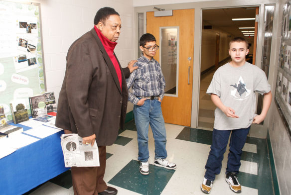 Alvis Johnson, left, a member of the Kentucky Board of Education, hears students in the Mercer County Day Treatment program discuss their beekeeping operation during a visit to the school
