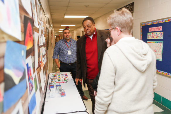 Kentucky Board of Education member Alvis Johnson, second from left, hears from a student at Mercer Central High School (Mercer County) about her work as principal Jaziel Guerra and teacher Lou Collins look on. Photo by Mike Marsee, Feb. 13, 2020