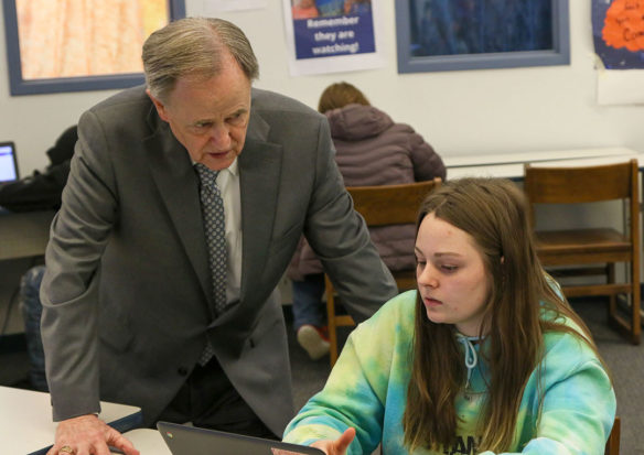 Kentucky Board of Education member Lee Todd talks with Sierra Cox, a freshman at Frankfort High School (Frankfort Independent) during a visit to the school. Photo by Jacob Perkins, Feb. 25, 2020