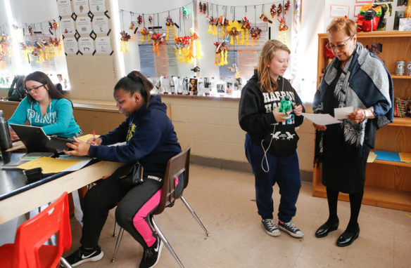 Sharon Porter Robinson, a member of the Kentucky Board of Education, talks with Brionna Jaggers, a junior at The Academy @ Shawnee (Jefferson County), in one of Jeramiah Elsner’s science classes. Photo by Toni Konz Tatman, Feb. 20, 2020