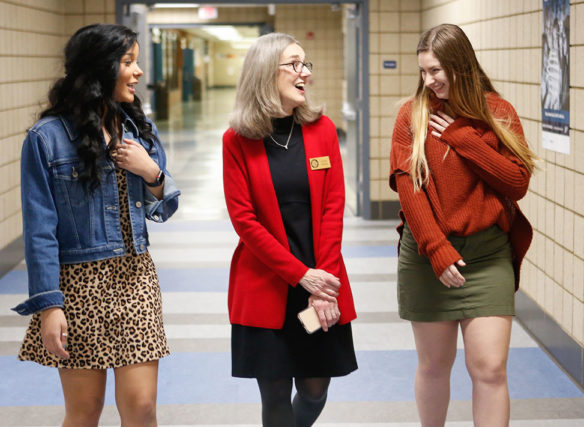 JoAnn Adams, center, a member of the Kentucky Board of Education, talks with McKenzie Hallman, left, and Keaton Mossman, two members of the Scott High School (Kenton County) student council, during a visit to the school. Photo by Mike Marsee, Feb. 26, 2020