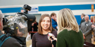 Laura Cole, a mathematics teacher at Scott High School (Kenton County) is interviewed by Lauren Minor of WXIX-TV after Cole was named a Milken Educator Award winner in a surprise ceremony at the school. Photo by Mike Marsee, Feb. 26, 2020