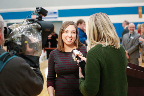 Laura Cole, a mathematics teacher at Scott High School (Kenton County) is interviewed by Lauren Minor of WXIX-TV after Cole was named a Milken Educator Award winner in a surprise ceremony at the school. Photo by Mike Marsee, Feb. 26, 2020