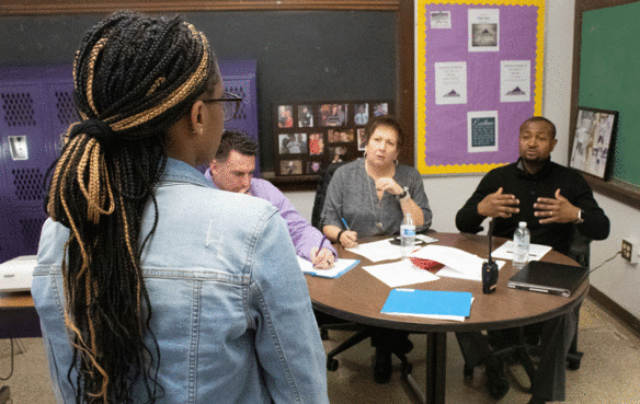 Kentucky Board of Education Vice Chair Lu Young sits on a defense committee at Barret Traditional Middle (Jefferson County).