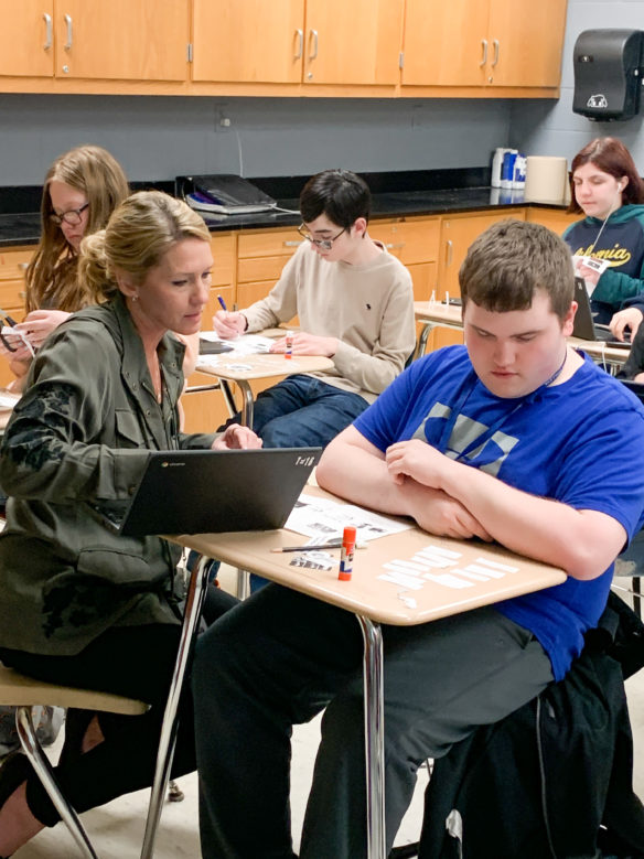 Tara Turner, a science teacher at Monroe County High School, works with student Austin Biggerstaff during a freshman science class. Photo by Teresa Emmert