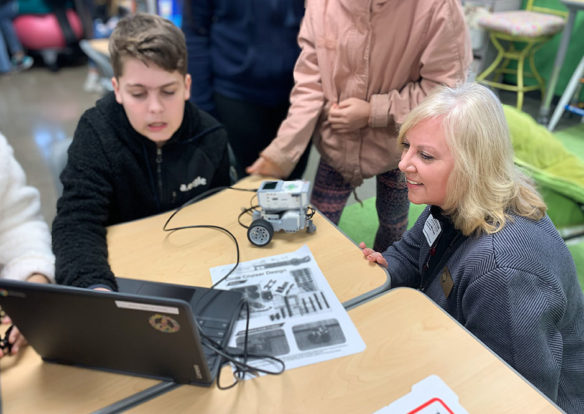 Patrice McCrary, a member of the Kentucky Board of Education, watches a student display his work in computer programming during a visit to Jennings Creek Elementary School (Warren County). Photo by Morgan Watson, Jan. 31, 2020