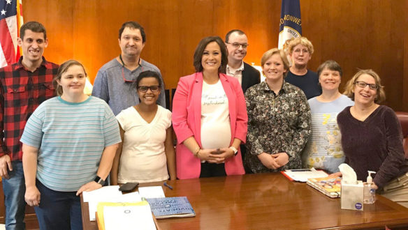 Lt. Gov. Jacqueline Coleman, center, meets with social studies teacher Mary Shouse of the Stewart Home and School and members of the school's student council to discuss civic engagement and community service.