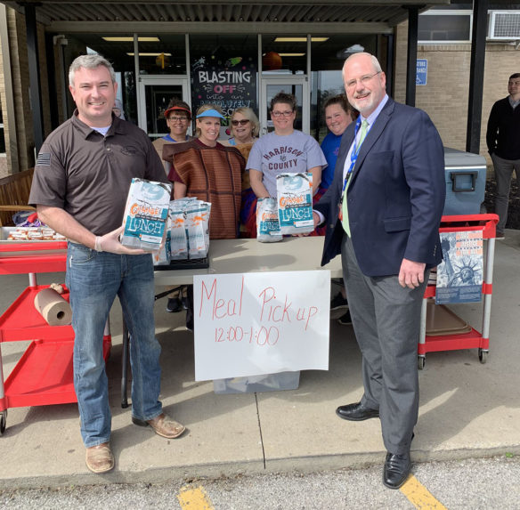 Harrison County Superintendent Harry Burchett stands with Kentucky Agriculture Commissioner Ryan Quarles outside of one of the district's two meal service locations.