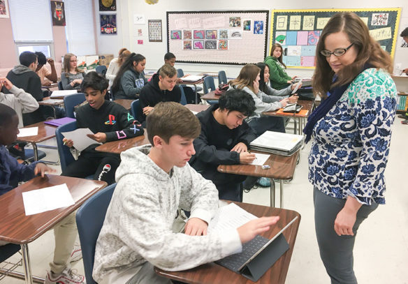 Elena Kamenetzky checks on the work of one of her students at Eastern High School (Jefferson County).