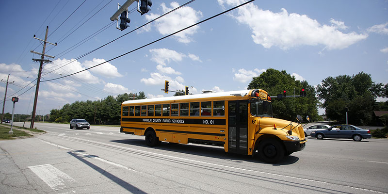 This is a file photo of a school bus driving down a street.