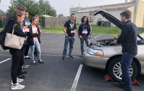 Seniors from the class of 2019 learning about cars in the Adulting 101 program.