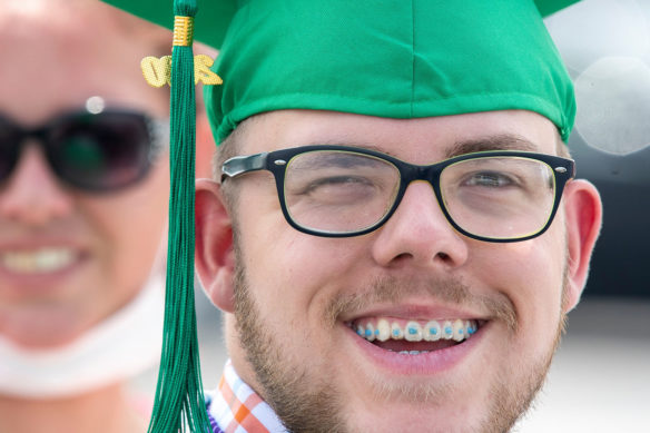Kentucky School for the Deaf graduate James David smiles for a picture during the school's graduation ceremony.