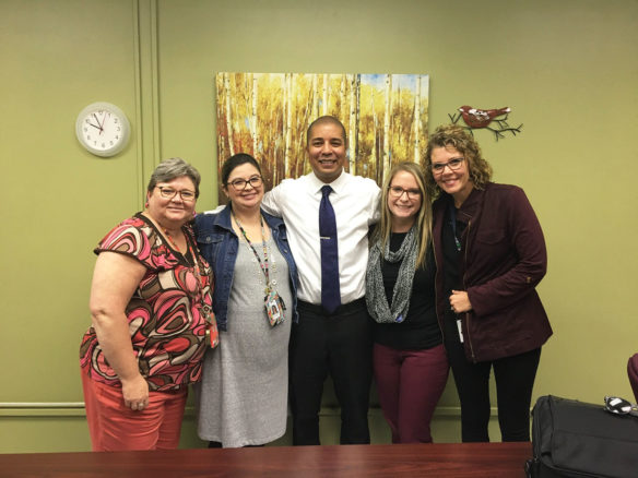 Damien Sweeney, center, the Kentucky Department of Education’s coordinator for comprehensive school counseling, poses with counselors from Fayette County Public Schools.