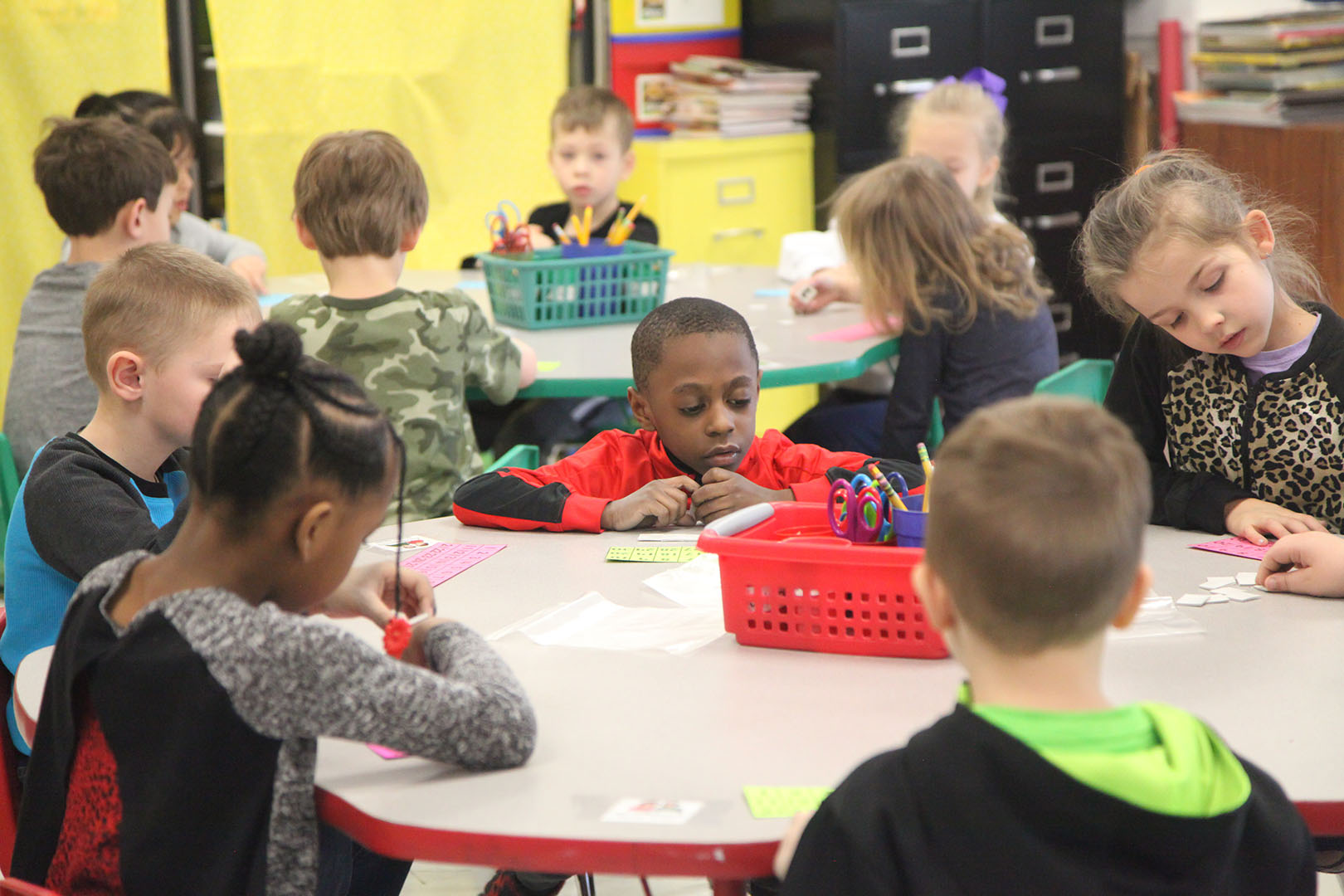 Students at Huntertown Elementary School work around a table in 2019.