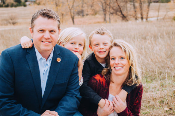 This is a photo of Jason Glass, his wife and their two children.