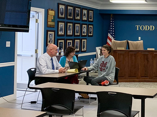 Todd County superintendent Mark Thomas reviews district plans with Assistant Superintendent Camille Dillingham and South Todd Elementary 5th-grade teacher Rachel Meyer.