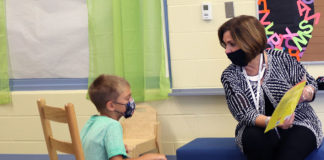 Sally Sugg, the new superintendent of Shelby County Schools, reads with a student during her visit to Shelby County’s Northside Early Childhood Center.
