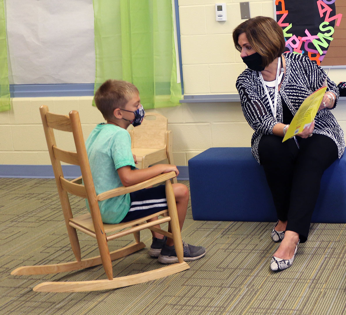 Sally Sugg, the new superintendent of Shelby County Schools, reads with a student during her visit to Shelby County’s Northside Early Childhood Center.