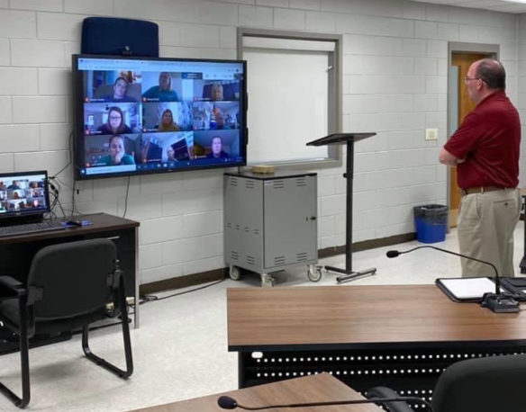 New Garrard County Superintendent Kevin Stull is pictured in a classroom talking to teachers on a videoconference call.